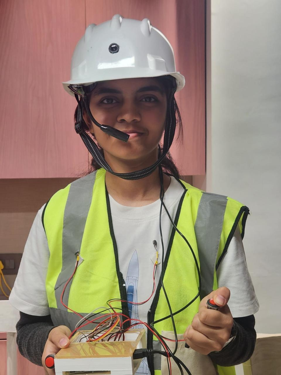 Kashvi wearing the AI-powered assistive wearable helmet prototype